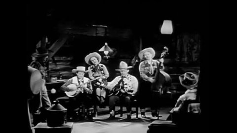 CIRCA 1940s - Lonesome cowboy Carson Robison sings a Western ballad in the 1940s.