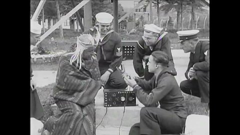 CIRCA 1920 - American soldiers show an American Indian how radio works in 1926.