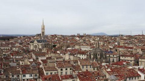 Amazing view over the roofs of Montpellier Ecusson cloudy day. low altitude