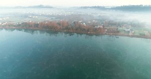 Aerial view of beautiful village by the Qingyi river in the morning at Sichuan China, mist floating on the river and village , new countryside of China 4k drone footage