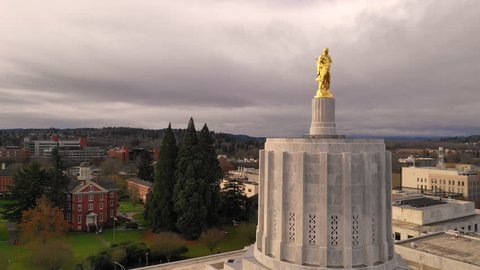 The Golden Woodcutter Oregon Pioneer atop the State Capital Building Salem