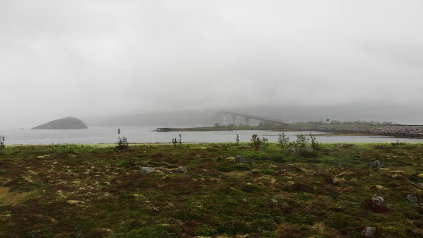 Aerial view. Bridge over fjord on Lofoten islands. Summer time, foggy hazy day, overcast weather