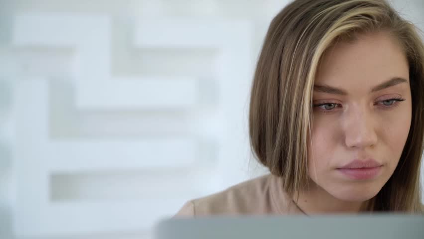 Close up portrait of attractive young woman using notebook on abstract maze background. Strategy and career concept. HD Slow motion