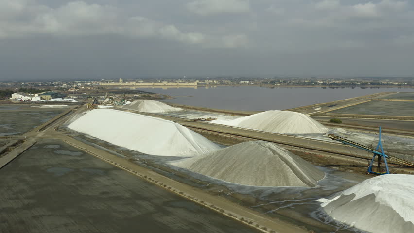 Aerial drone view of the salt marshes of Aigues-Mortes, Saltworks of the South, cloudy day