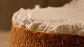 Smearing Cream on Cake layer with brush Slow motion Close up Macro shot cooking video
