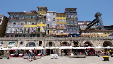 PORTO, PORTUGAL - JUNY 14, 2017: Cais da Ribeira promenade along the riverfront area of Ribeira in Porto, Portugal.
