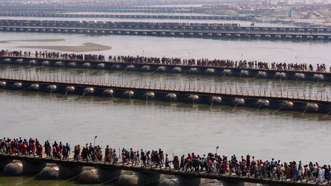 Allahabad (Prayagraj), India, pilgrims crossing the pontoon bridges over the Ganges river at Kumbh Mela Festival 2019.