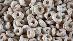Round oat cereal pieces close up spinning video