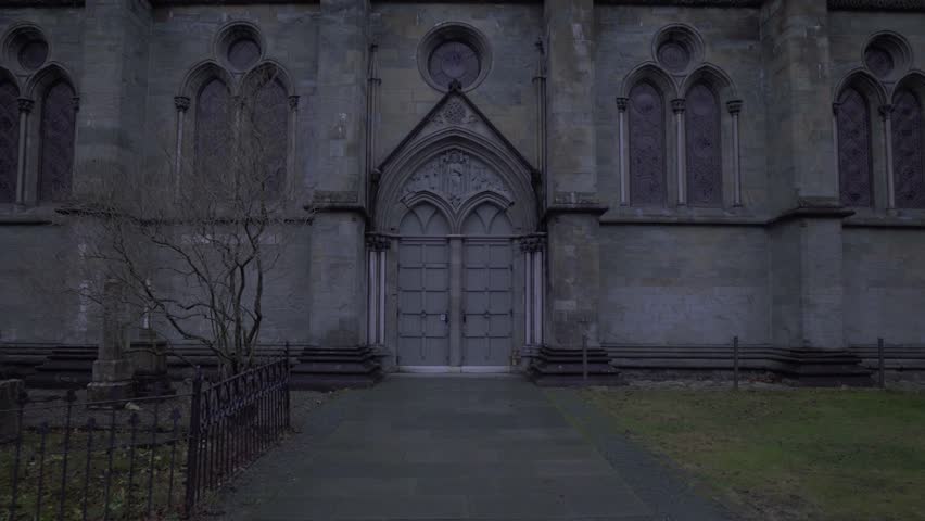 Zoom in on two sealed doors of a creepy looking castle, Trondheim, Norway, 4K. | Shutterstock HD Video #1024222376