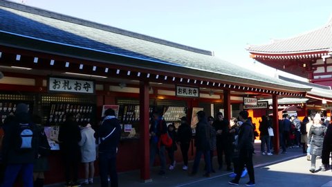 TOKYO, JAPAN - FEBRUARY 1, 2019: Crowds of tourists visit Sensoji Temple in Asakusa prefecture, Tokyo. Senso-ji Buddhist temple is dedicated to the bodhisattva Kannon