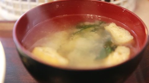 Close-up of Japanese miso soup in a bowl on the table