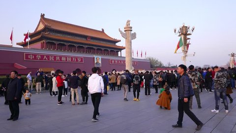 BEIJING, CHINA - MARCH 23 2018: People crowded at Tiananmen Square. Tourists near Tiananmen gate.