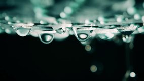 Slow motion macro shot of falling water drops - Powered by Shutterstock - Get 15% off with code: PIKWIZARD15