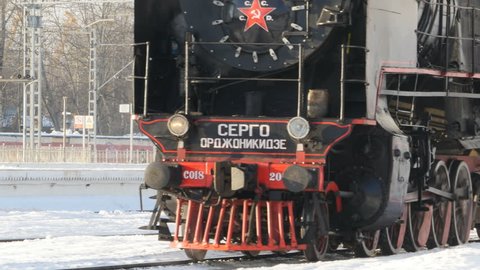 St. Petersburg, Russia circa January 2019 Soviet steam locomotive smokes hot steam approaching