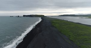 Iceland aerial drone video of Iceland famous black sand beach Reynisfjara. Landscape travel video of amazing nature on Iceland on South Iceland. 4K drone.