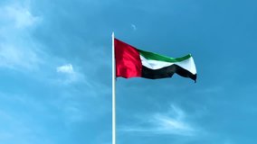 United Arab Emirates flag waving in against blue sky, uae flag perfect for film, news, digital composition, uae flag day , national day 48
