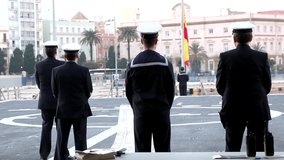Performing the daily Flag Lowering Ceremony in spanish military ship - Powered by Shutterstock - Get 15% off with code: PIKWIZARD15