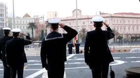 Performing the daily Flag Lowering Ceremony in spanish military ship - Powered by Shutterstock - Get 15% off with code: PIKWIZARD15