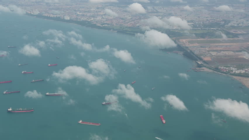 4K Aerial view of many container ships anchored at water area against port terminals Royalty-Free Stock Footage #1024287878
