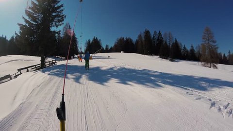 February 2018, La Villa, Italy - A skier going up on a ski lift, action camera footage