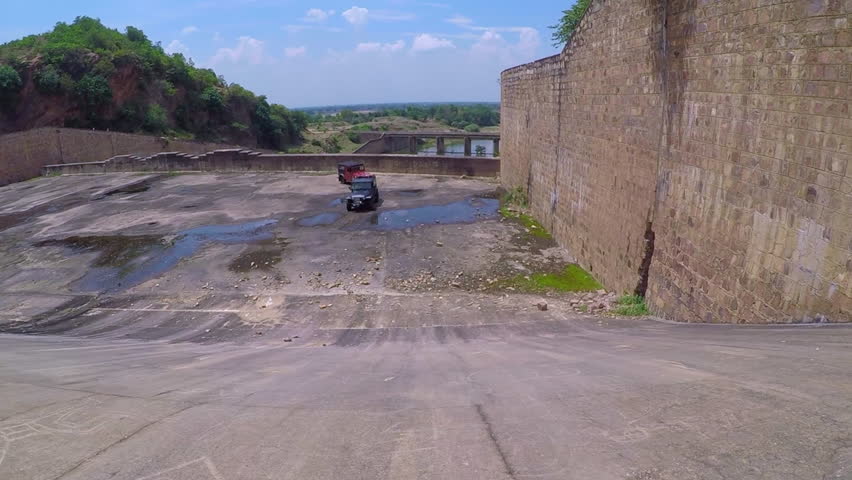 Point of view from a off road vehicle getting down in the dam