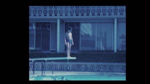 San Francisco, California, USA- 1971: Reluctant boy and brother dive into hotel pool