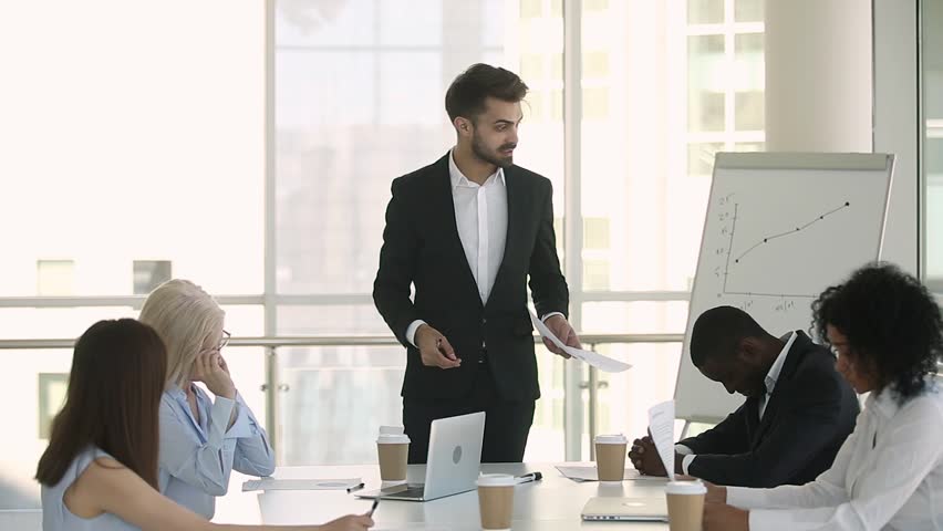 Mad manager boss scolding employees group shouting at office meeting criticizing angry about corporate failure business problem, furious executive team leader ceo yell at staff meeting in boardroom Royalty-Free Stock Footage #1024307021