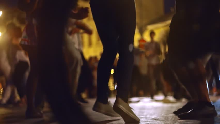 Ground level shot of young people dancing salsa on open-air festivale