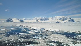 Antarctica Peninsula Ocean Shore Seascape Aerial View. Arctic Majestic Brash Ice Floe on Mountain Horizon. Sunny Day Global Warming Concept in Alaska Landscape Drone Shot Footage 4K (UHD) - Powered by Shutterstock - Get 15% off with code: PIKWIZARD15