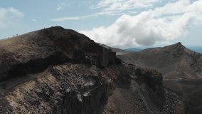 active volcano area mountain smoking tongariro aerial video camera horizontal move dry lanscape clouds soft light active volcano
hiking way to the top