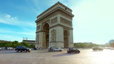 Traffic in front of The Arc de Triomphe de l'Etoile is one of the most famous monuments, hyperlapse cinematic view