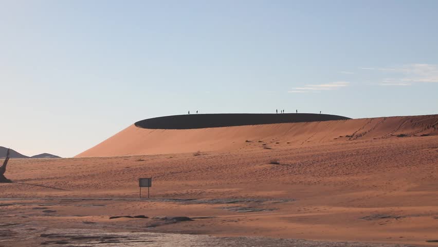 Giant Red Sand Dunes of Sossusvlei, Namibia in Namib Desert. Highest dunes in the world in afternoon sunlight with view on salt pan from Big Mama dune