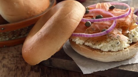 Toasted bagel with cream cheese and smoked salmon gravlax.