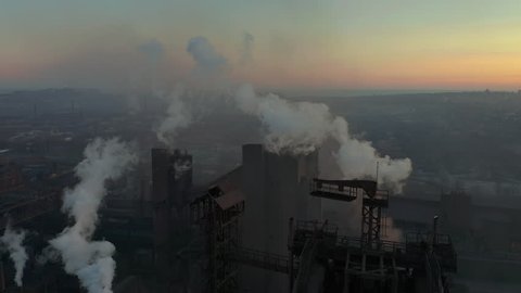 Blast furnace view from the air. Old factory. Aerial view over industrialized city with air atmosphere pollution from metallurgical plant.