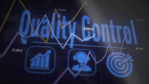Quality Control business concept on a flashing computer monitor with moving graphs and data.
