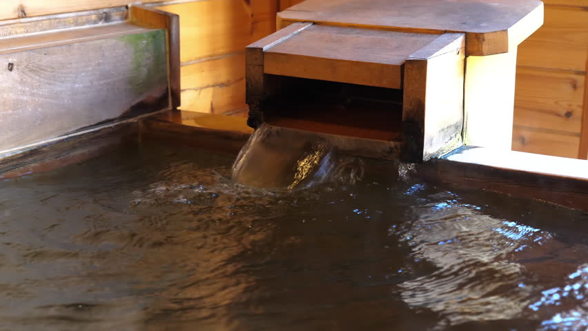 Raditonal wooden bathtub in a Japanese ryokan. Shot in 4K