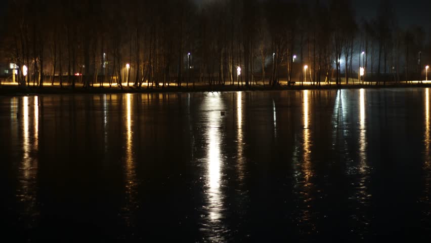 Full Moon Light Reflection On The River Ice At Night. 4K Time Lapse