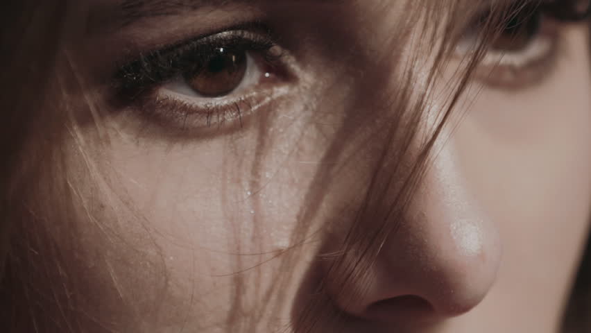 Macro shoot of pretty girl easy wipes tears under eyes. Slowly | Shutterstock HD Video #1024419077