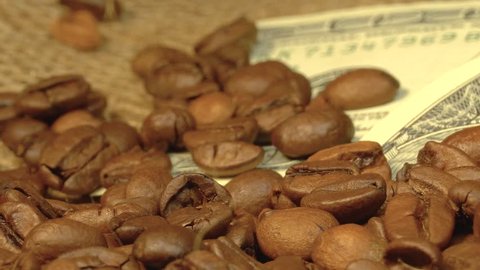 Coffee grains fall on American dollars, grains pour on money