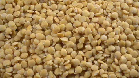 Raw yellow lentils, rotating texture