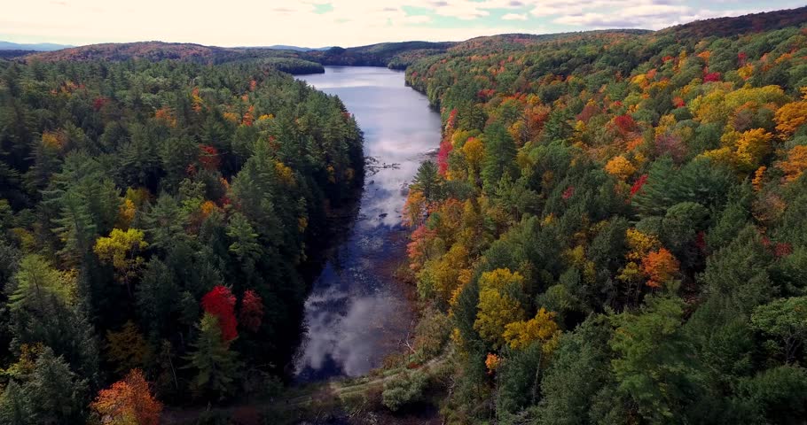 An autumnal lake in the woods of New England