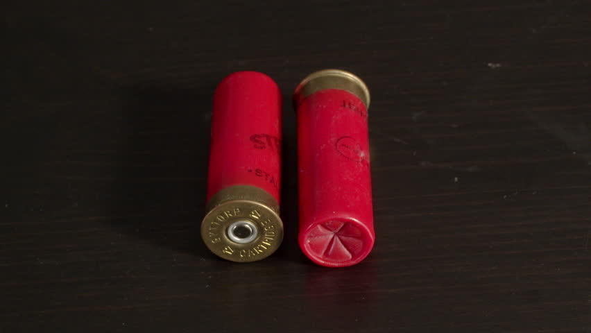 12 gauge shotgun shells laying on Stok Videosu (%100 Telifsiz) 1024442087 S...