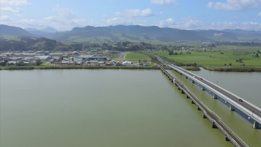 Aerial: Flying over the Thames river & Kopu Bridge in the gateway to Coromandel peninsula, New Zealand 