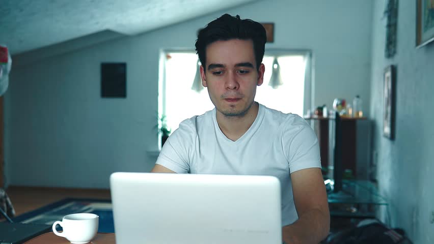 Man is working on a laptop | Shutterstock HD Video #1024449386