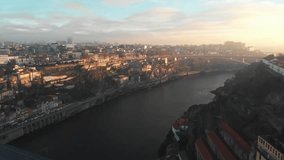 Aerial view of Douro river and the city of Porto (Portugal) during sunset/sunrise