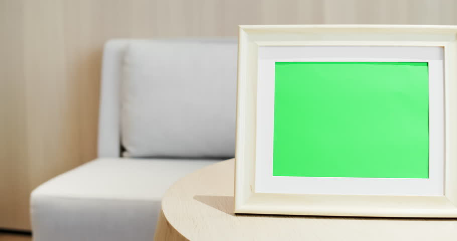 close up of photo frame with green copys space on table at home Royalty-Free Stock Footage #1024455431
