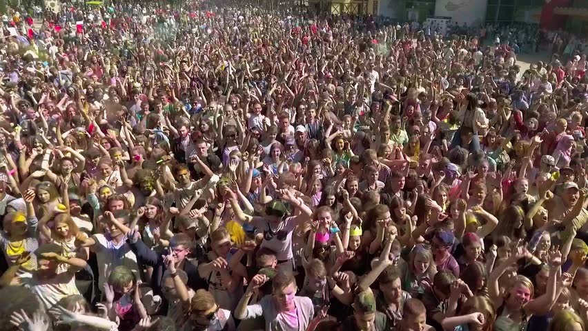 Kharkiv, Ukraine - Apr 30, 2017: aerial of happy people dancing at Holi festival Royalty-Free Stock Footage #1024464527