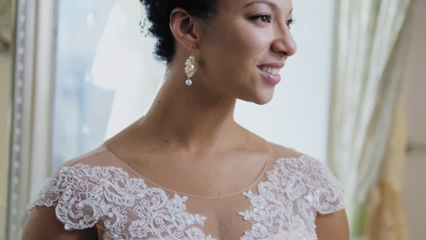 Beautifu bride choosing wedding dress in a wedding salon