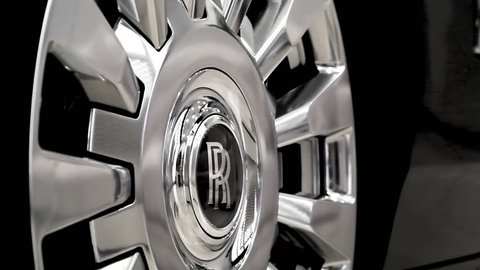 Moscow, Russia - February, 2019: The Rolls Royce Phantom VIII at dealer showroom. Closeup of wheel