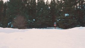 human feet go in deep snow. slow motion video. man traveler with backpack walks in the snow forest winter. overcoming difficulties concept problems difficult path to success concept travel lifestyle